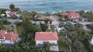 an aerial view of a house with a red roof at Dream house by the sea in Mola Kalyva