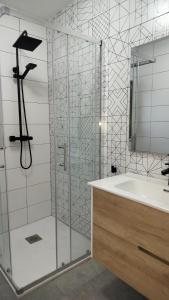 a bathroom with a shower and a sink at LOVE Rural in La Mata de Morrella