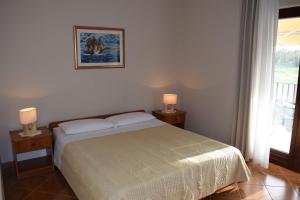 Postel nebo postele na pokoji v ubytování Apartments Nevenka