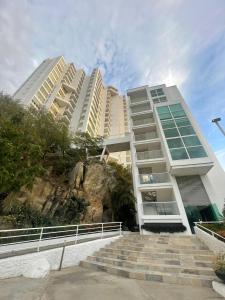 a building with stairs in front of some buildings at Apartamento Frente al Mar in Santa Marta
