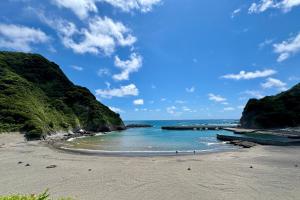 a beach with a view of the ocean at Iruma INN in Minamiizu