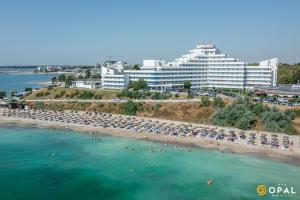 an aerial view of a beach with a large building at Hotel Opal in Jupiter