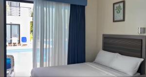 Ένα ή περισσότερα κρεβάτια σε δωμάτιο στο Green Nature Resort and Leisure Park Nagcarlan Laguna