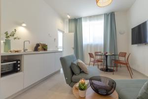 a living room with a couch and a table at mari DAMARI in Riposto