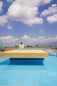 a pool on the roof of a building at Arka Art Theatre Atelier in Tirana