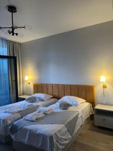 Postel nebo postele na pokoji v ubytování sea side