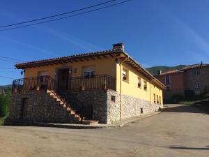 a house with a staircase on the side of it at Casa Mariana in Parres de Llanes