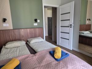 Postel nebo postele na pokoji v ubytování Urban Jungle Apartament Bill