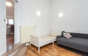 a living room with a couch and a table at Apartman Nika in Omišalj