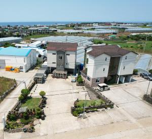 an aerial view of a city with buildings at White star in Jeju