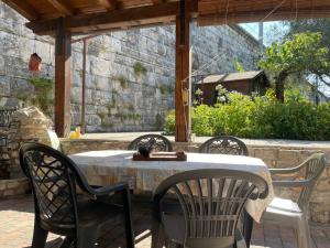 a table and four chairs on a patio at Serenissima in Monfalcone