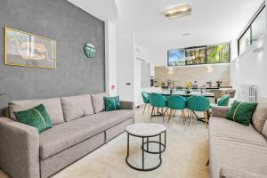 a living room with a couch and a table at Luxury House Jacuzzi - Milano in Milan