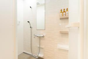 a shower in a bathroom with a glass door at air駅前民泊 in Izumi-Sano +45 photos