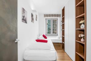 a living room with a white couch and a window at Luxury Brera apartment - Corso Como 9 in Milan
