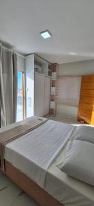 Postel nebo postele na pokoji v ubytování Eficiência - Casa Recanto dos Ventos