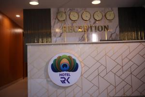 a hotel rx sign on a wall in a lobby at Hotel RK Koramangala in Bangalore