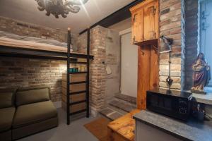 a living room with a bunk bed and a couch at Apartament by the cathedral in Lublin