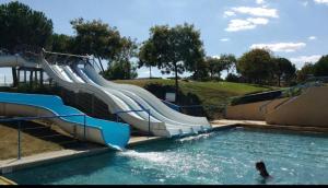 a slide in a swimming pool at a water park at Monette in Condom