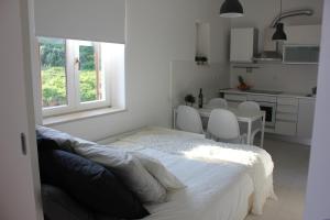 Posteľ alebo postele v izbe v ubytovaní Smile & Enjoy Apartments