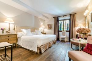 Postel nebo postele na pokoji v ubytování Grand Hotel Don Gregorio