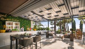 a rendering of a restaurant with a table and chairs at Remisens CASA ROSA - Hotel Metropol Annexe in Portorož