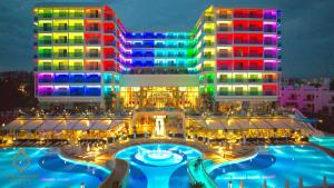 a hotel with a pool in front of a building at Azura Deluxe Resort & Spa - Ultra All Inclusive in Avsallar