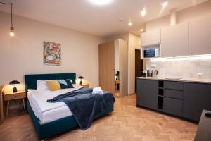 En eller flere senge i et værelse på Upisa Studio Apartments