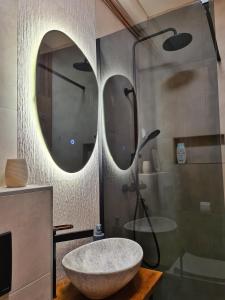 a bathroom with a large marble sink and a shower at Castrum Walkow in Vukovar +36 photos