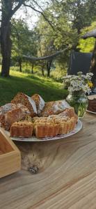 a plate of bread on a wooden table at Turistična kmetija Pod kostanji - FarmStay Pod kostanji in Motnik
