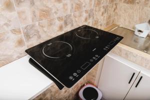 a stove top oven sitting on top of a counter at Senlodge in Dakar +5 photos