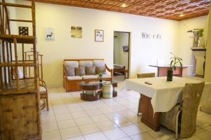 a living room with a couch and a table at Hotel Mahamanina in Fianarantsoa