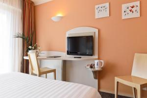 TV a/nebo společenská místnost v ubytování Best Western Astoria