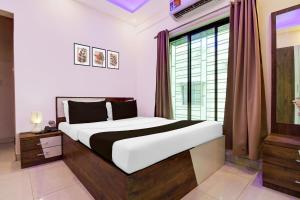 Ένα ή περισσότερα κρεβάτια σε δωμάτιο στο Hotel O Himgiri Guest House