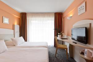 Postel nebo postele na pokoji v ubytování Best Western Astoria