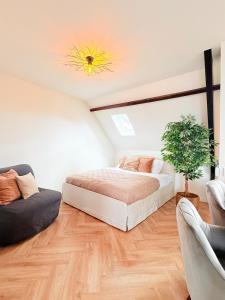 a bedroom with two beds and a ceiling with a sun at Cooth's Luxury Loft with City Views in Breda