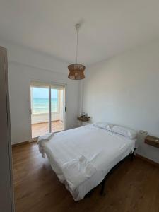Ένα ή περισσότερα κρεβάτια σε δωμάτιο στο El Encanto del Perelló