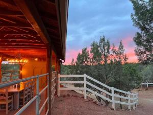 a porch of a house with a white fence at Prime location with Hot tub Pool and Views for Family in Sedona