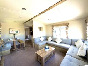 a living room with a couch and a table at The Bay in Filey