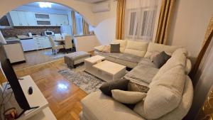 a living room with a couch and a table at Village Villa in Bijelo Polje