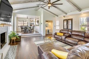 a living room with a couch and a fireplace at El Paso Oasis Near Franklin Mountains State Park in El Paso