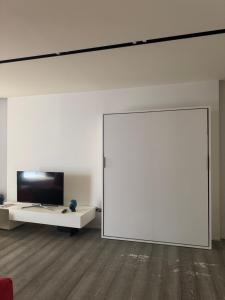 TV a/nebo společenská místnost v ubytování Loft Amaka