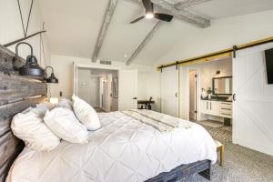 a bedroom with a large bed with white pillows at El Paso Oasis Near Franklin Mountains State Park in El Paso
