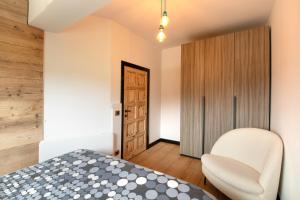 a room with a table and a chair and a door at La Perla di Livata in Livata