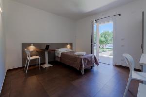 En eller flere senge i et værelse på Resort La Ficaccia + 43 billeder