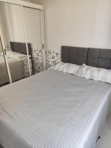 Katil atau katil-katil dalam bilik di Apartamento Green Home