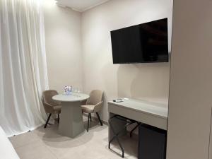 TV a/nebo společenská místnost v ubytování Lolli Boutique & SPA Al Massimo + 23 fotografií