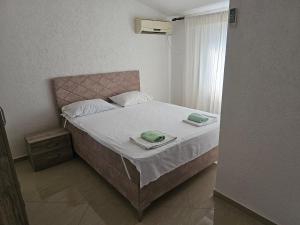 Postel nebo postele na pokoji v ubytování Esko Rooms