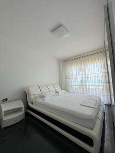 Postel nebo postele na pokoji v ubytování La Perla Rossa