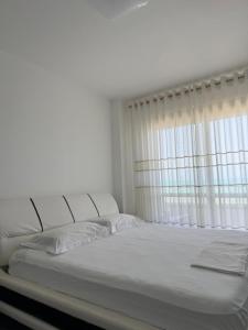 Postel nebo postele na pokoji v ubytování La Perla Rossa + 8 fotografií