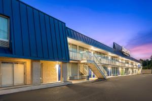 a building with a staircase on the side of it at Days Inn by Wyndham Harrisonburg in Harrisonburg